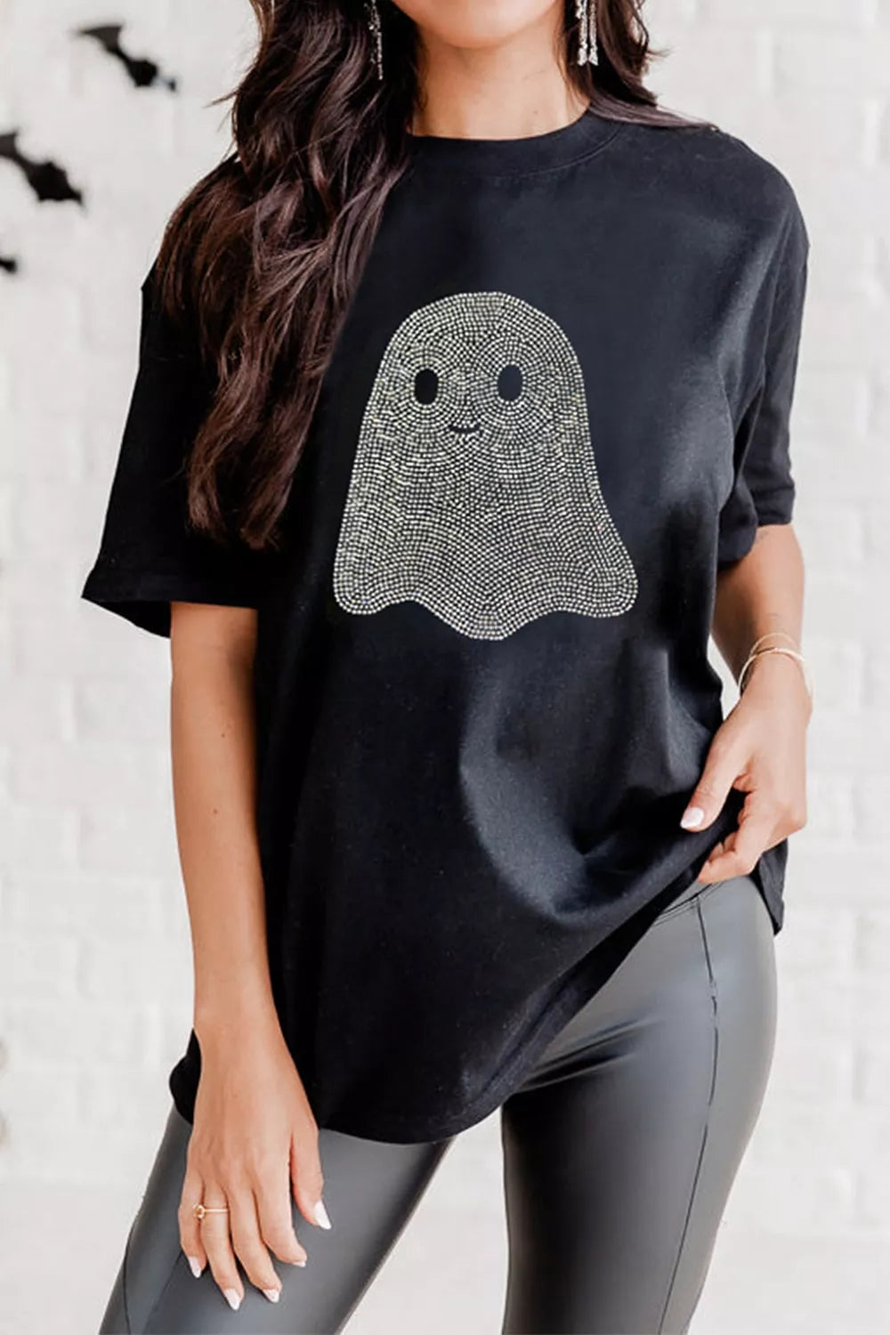 Woman wearing black plus size rhinestone ghost Halloween T-shirt